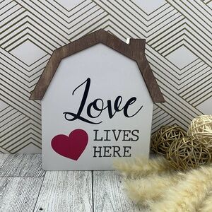 Wooden house love lives here.